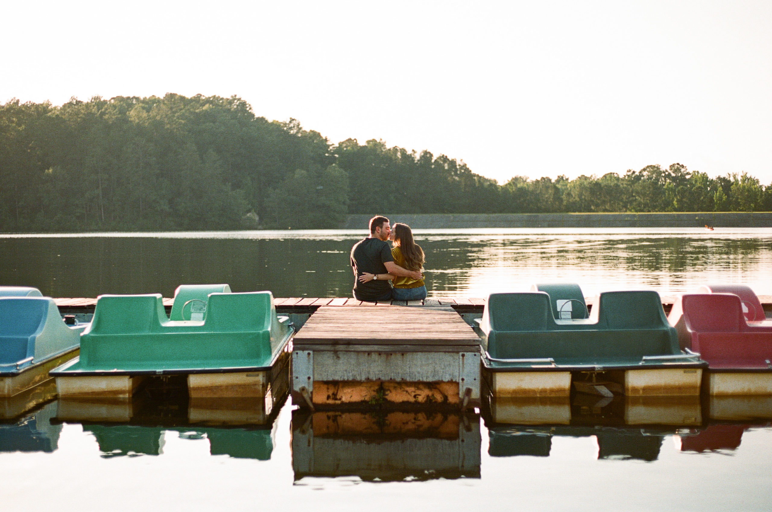 Couple sitting on a dock at Oak Mountain State Park