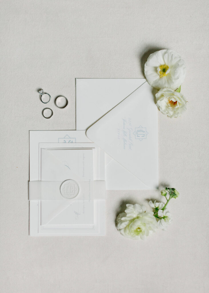 Invitation flat lay at a Donnelly House wedding from a Birmingham AL wedding photographer