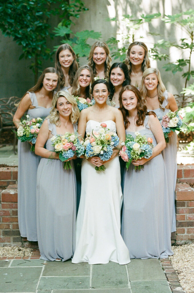 Grey bridesmaids dresses and colorful bouquets. Photos by a Birmingham, AL wedding photographer