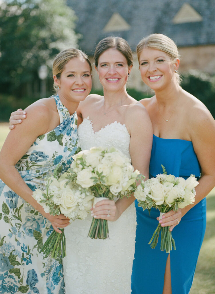 Different blue bridesmaids dresses at Country Club of Birmingham