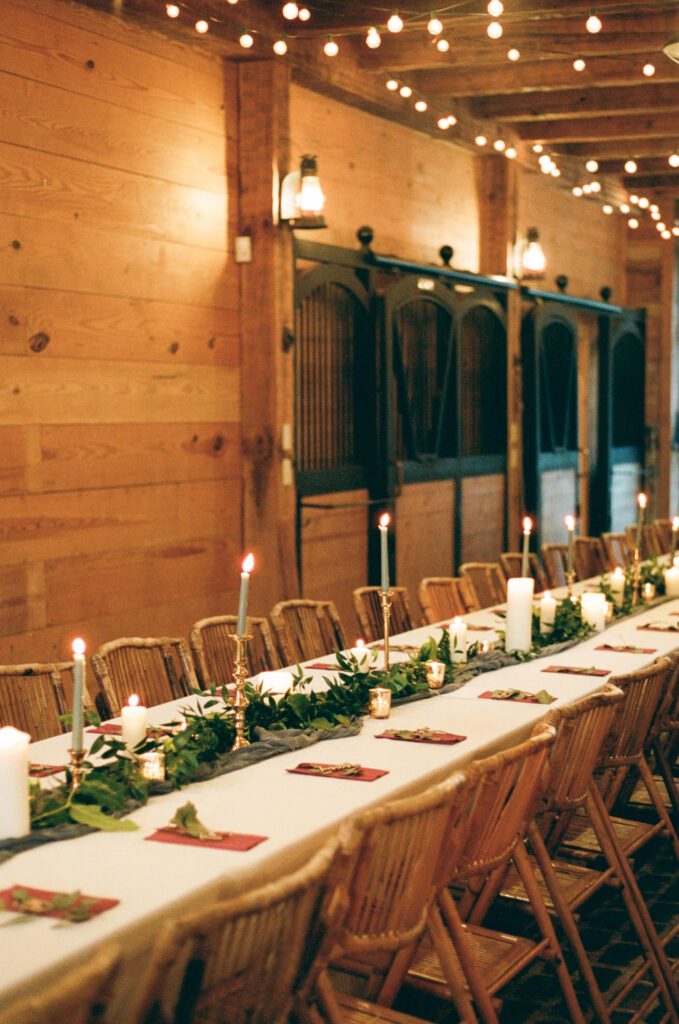 Intimate wedding reception with a banquet table at Swann Lake Stables in Birmingham, AL
