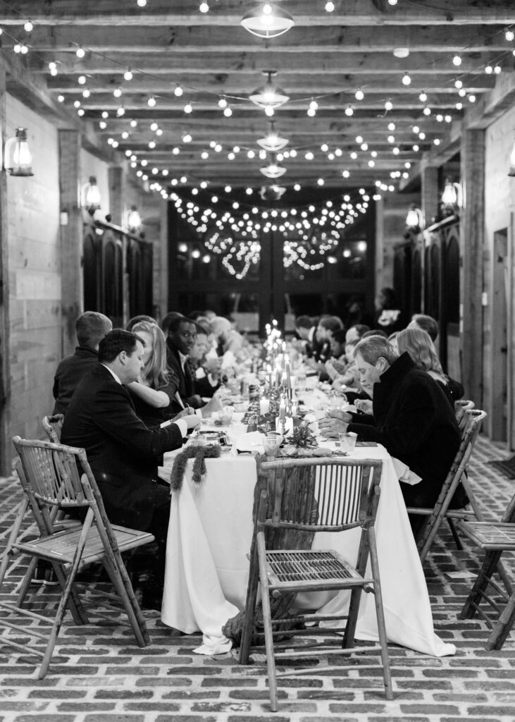 Intimate wedding reception with a banquet table at Swann Lake Stables in Birmingham, AL