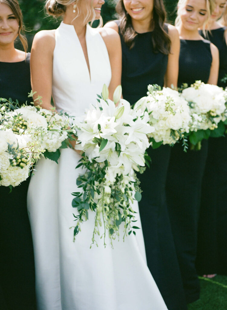 Black bridesmaids dresses photographed by a Birmingham AL film wedding photographer