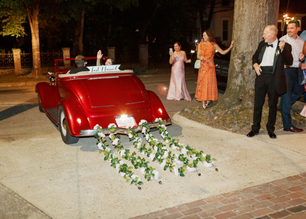 Classic red getaway car at a wedding at The Colonnade House in Columbus, MS