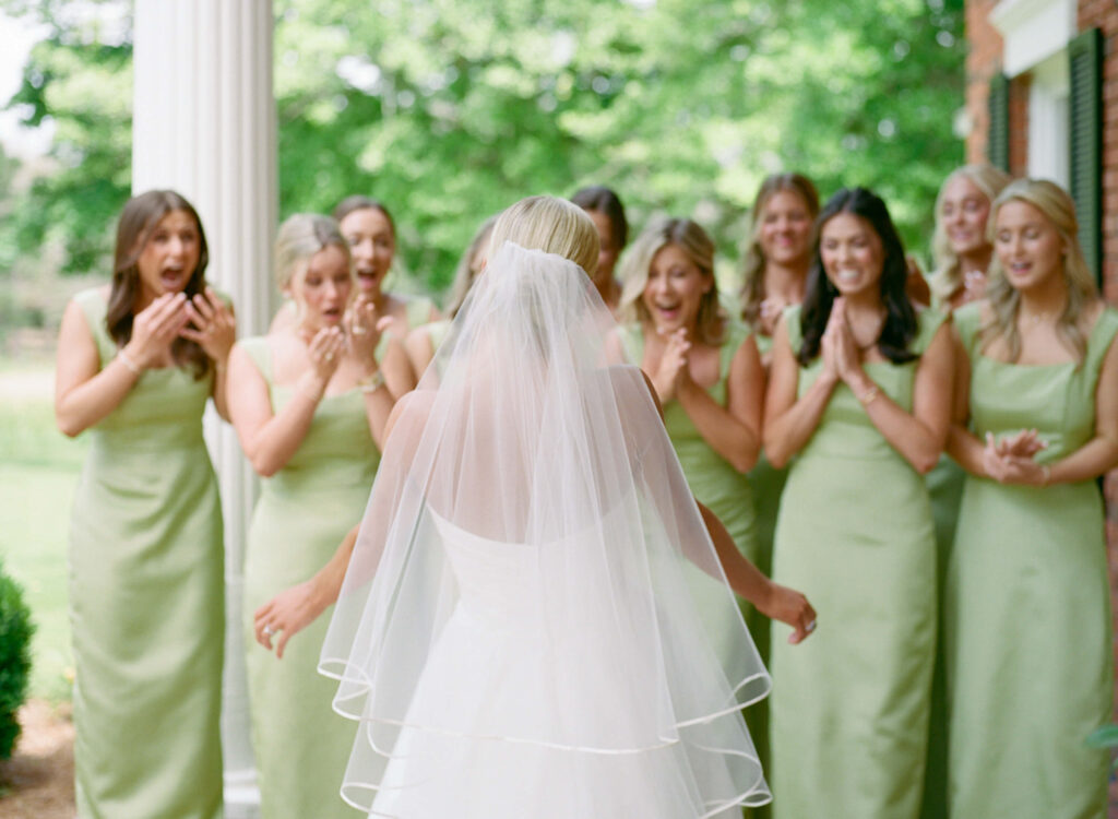 Bridesmaid first look with apple green bridesmaids dresses 