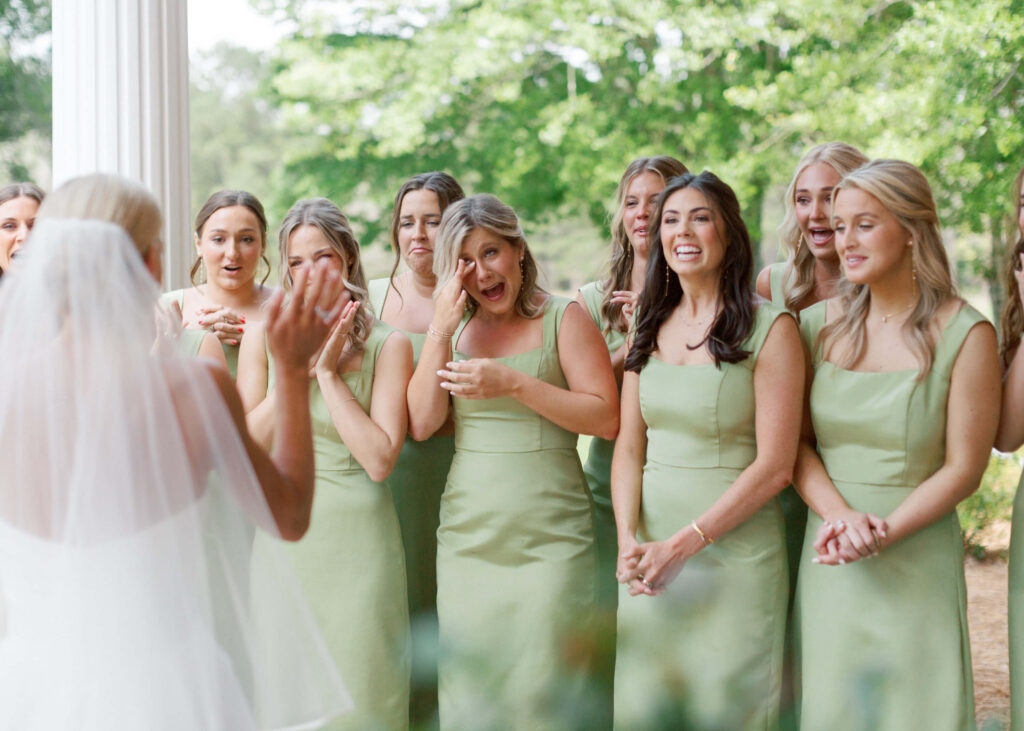 Bridesmaid first look with apple green bridesmaids dresses