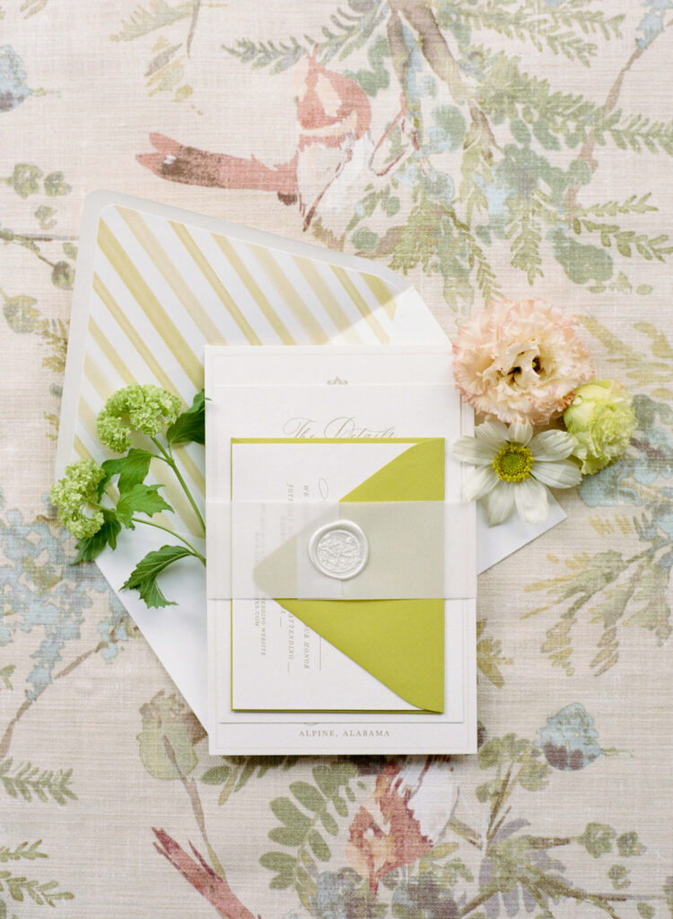 Invitation flat lay by an Alabama film wedding photographer