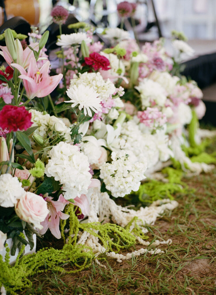 Pink and green wedding stage florals